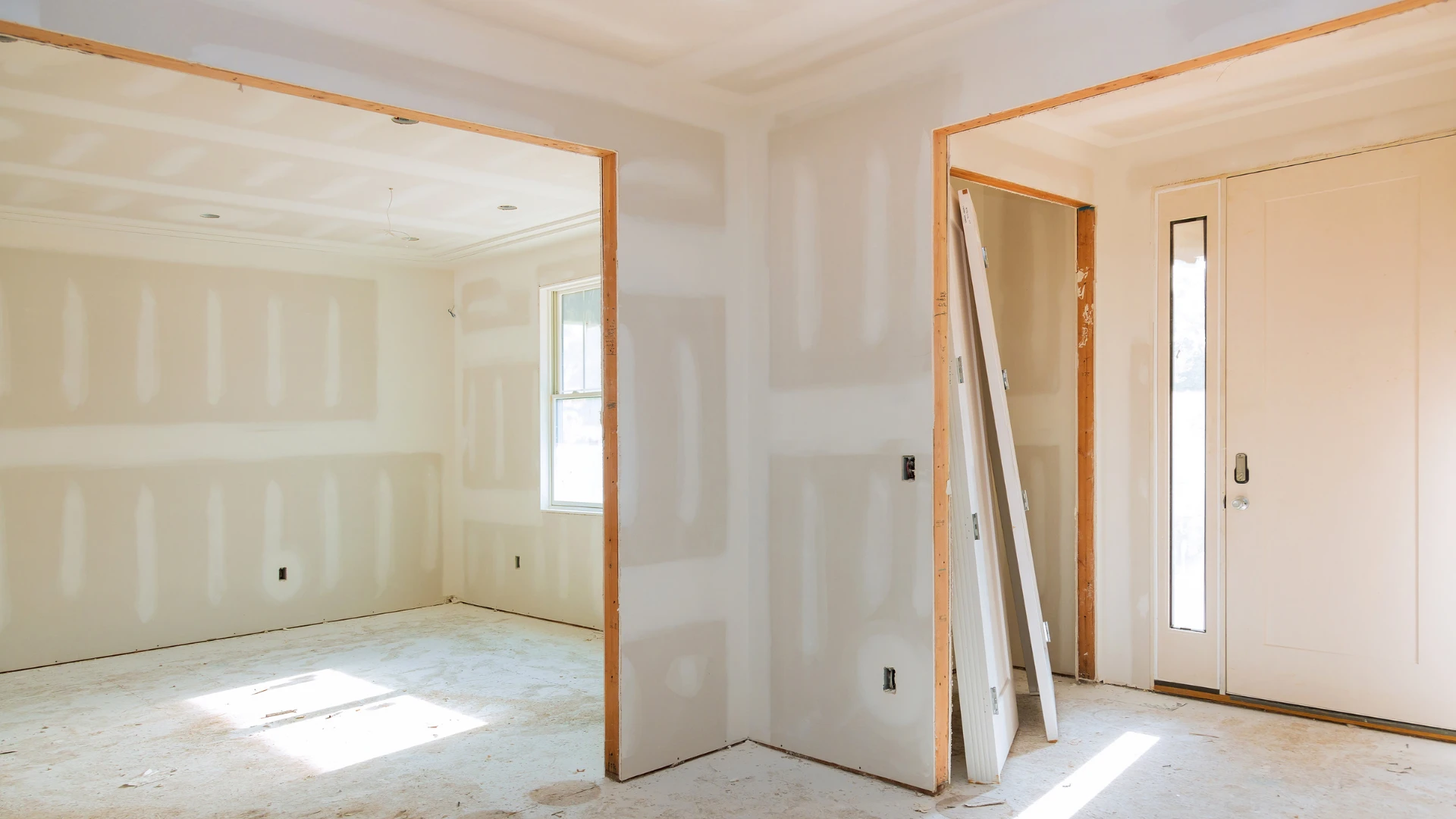 Drywall sheets and finishing tools in a home under repair